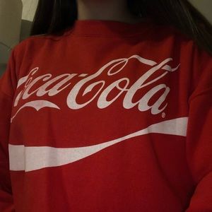 Red Coca-Cola sweater.